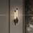 Настенный светильник с двумя плафонами вытянутой цилиндрической формы на металлическом основании VALA WALL A латунь фото 10